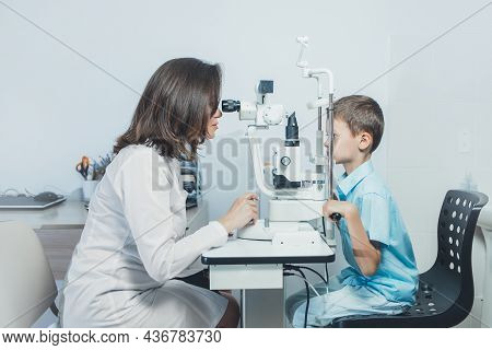 Ophthalmologist Checks The Boy's Vision. Hyperopia. Vision Tests In Children.