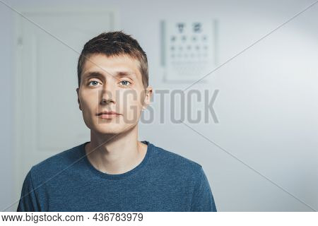 Young Man At A Reception Ophthalmologist. Vision Tests At Hospital. Copy Space