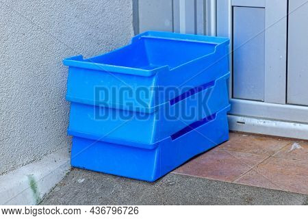 Stacked Milk Crates In Front Of Shop Door Delivery