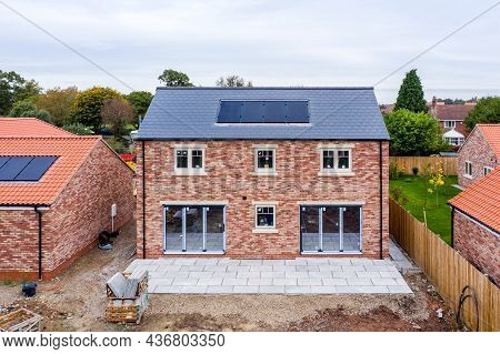 Skipwith, Uk - October 20, 2021.  A New Build Home With Built In Photovoltaic Solar Panels In The Ro
