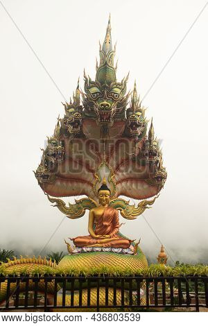 Sakon Nakhon,thailand - October 1 , 2020 : A Large Golden Seated Buddha Statue Outdoors, Sheltered B