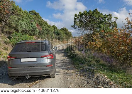 A Car Drives Along A Dirt Road Through The Maly Utrish Nature Reserve In The Krasnodar Territory.