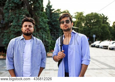 Two Indian Student With Backback Stand At The Street.