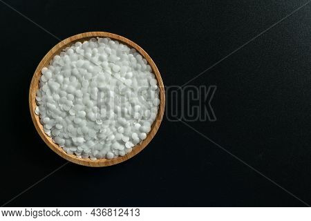 White Plastic Beads On Wood  Background, Polymers Bead Or Polymer Resin, Polymer Pallet, Product Fro