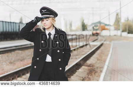 European Or American Train Conductor Is On His Duty On A Platform And Other Trains. Railway, Steam T