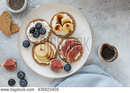 Oat Crispbread With Cream Cheese, Banana, Blueberry, Pear, Fig And Date Syrup. Healthy Fitness Break