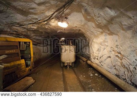 Hutch Cart With Raw Material Standing At Underground Mining. Production And Technology Concept. Tunn
