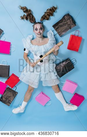 Top View Of Young Girl With Bright Make-up For Celebrating Halloween Or Day Of The Dead. Costume Of 