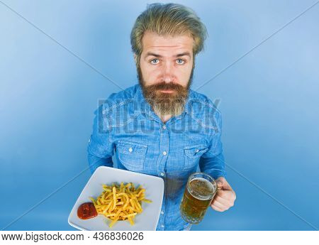 Street Food. Fast Food. Man With Potato Fries. Beer. French Fries Potato. Man Drinking Beer And Eati
