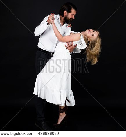 Dancing, Salsa, Tango. Young Elegant Tango Dancers. Couple Dancing Waltz. Ballroom.