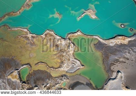 Drone View Of The Turquoise Lake Formed As A Result Of Mining Waste
