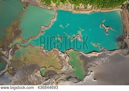 Drone View Of The Turquoise Lake Formed As A Result Of Mining Waste
