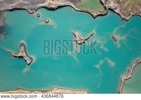 Drone View Of The Turquoise Lake Formed As A Result Of Mining Waste