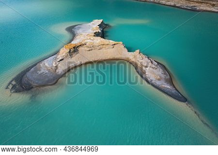 Drone View Of The Turquoise Lake Formed As A Result Of Mining Waste