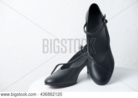 A Pair Of Classical Dancing Shoes On A White Round Table