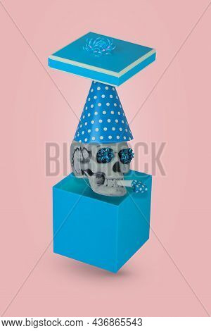 Human Skull With A Red Birthday Cap And Whistle Coming Out Of The Gift Box Isolated On A Pink Backgr