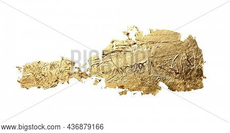 Abstract torn piece of metal leaf (potal) paper on white background. Gold glitter and bronze color. 