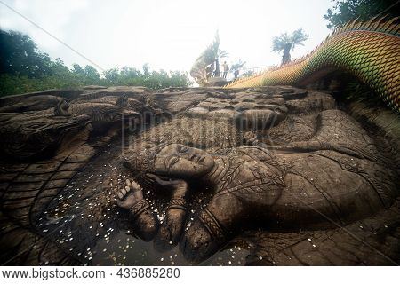 Sakon Nakhon,thailand - October 1 , 2020 : The Statue Is Carved In The Form Of An Angel Lying On Sto
