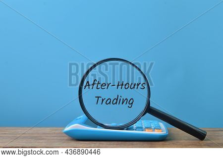 Calculator And Magnifying Glass With Text After-hours Trading