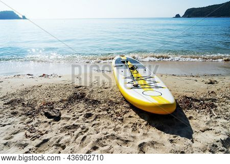 Empty Seaside Landscape Sea Sand Beach With Supboard On Coast Calm Wave Water Surface