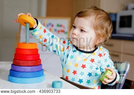 Cute Beautiful Little Baby Girl Playing With Educational Toys At Home Or Nursery, Indoors. Happy Hea