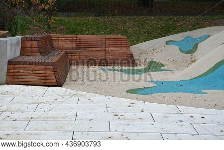 Dreamy White Rubber Landscape With Scoops And Colorful Spots On The Playground. Stainless Steel Tunn