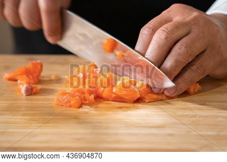 Close Up To Slicing Cube Salmon By Motion Movement Knife By Prefessional Chef.