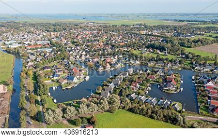 Aerial from the traditional village Koudum in Friesland Netherlands