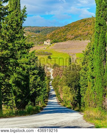 Abbey of Sant Antimo. Magnificent Italy. Charming abbey among vineyards and fields. The magical beauty of the province of Tuscany. Sunny day at the beginning of winter. 