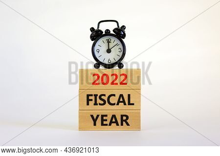 2022 Fiscal New Year Symbol. Concept Words '2022 Fiscal Year' On Wooden Blocks. Black Alarm Clock. B