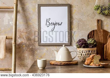 Stylish Interior Of Kitchen Space With Wooden Table, Brown Mock Up Photo Frame, Herbs, Vegetables, T