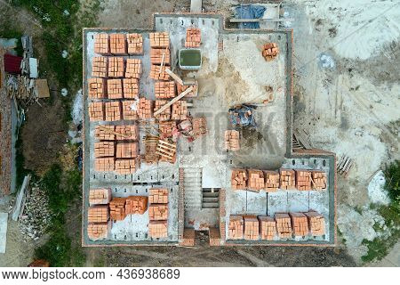 Top Down Aerial View Of Building Works Of New House Concrete Foundation On Construction Site.