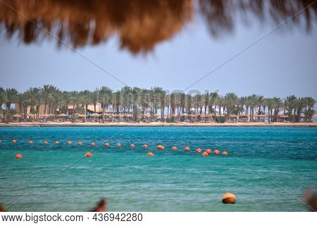 Yellow Buoys Floating On Sea Surface As Marker For Swimming Restriction In Deep Water At Tropical Re