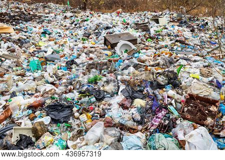 Verkhnie-sergi, Russia - May 02, 2021. Household Waste, Landfill. Unauthorized Dump On The Field. Ga