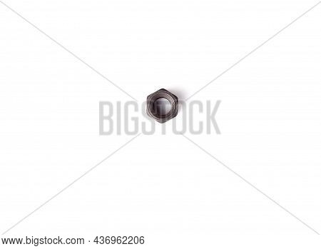 One Macro Metallic Nut Isolated On White Background. Heavy Hex Nut. Female Screw Nut With Copy Space