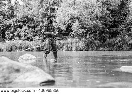 I Choose My Passion. Man Catching Fish. Mature Man Fly Fishing. Fisherman Show Fishing Technique Use