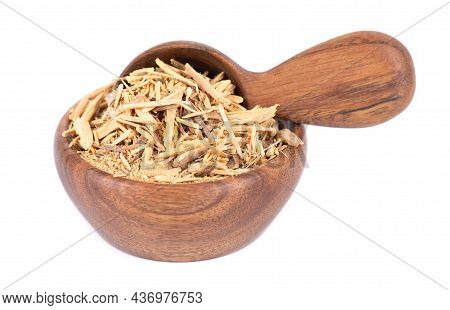 Muira Puama Herbal Tea In Wooden Bowl And Spoon, Isolated On White Background. Natural Potency Wood,