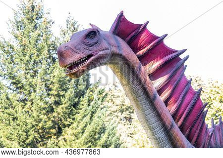 Ukraine, Khmelnitsky, October 2021. Dinosaur, Amargasauruss Close Up With Open Mouth And With A Long