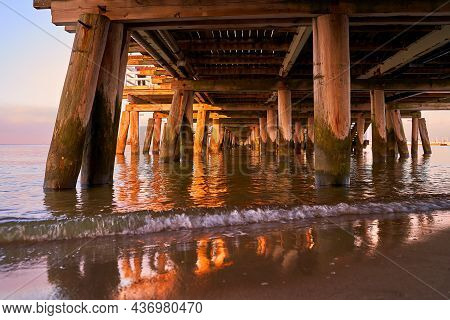 Sopot Pier At Dusk. Bottow Low Angle View Of The Wooden Structure.