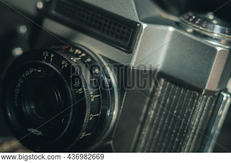 Soviet Manual Lens Industar 50-2 On A Film Camera Zenit-e. Black Background, Copy Space, Deep Shadow