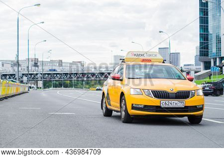 Moscow, Russia - September 2021: Fast Moving Yandex Taxi Car On Moscow Streets. Taxi Yandex Goes Dow