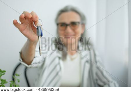 Senior Realtor, Estate Agent Makes Real Estate Deal With Home Buyers, Gives The Keys Frome New House