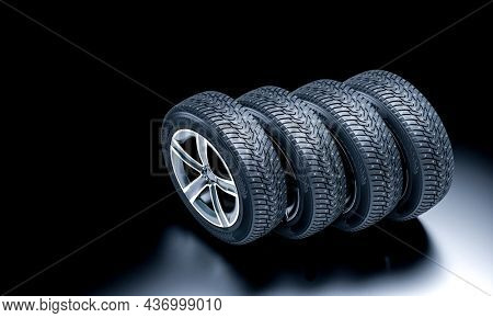 detail of new snow tires on a dark background. 3d render