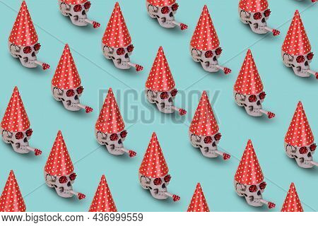 Pattern Of Human Skull  With A Red Birthday Cap And Whistle On A Blue Background. Minimal Holiday Ce