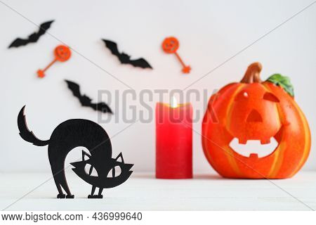 Halloween Card With Black Cat, Candle, Jack-o-latern And Bats. Selective Focus