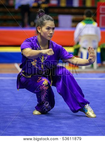 KUALA LUMPUR - NOV 03:  Tai Cheau Xuen of Malaysia shows her fighting style in the 'Nan quan compulsory' event at the 12th World Wushu Championship on November 03, 2013 in Kuala Lumpur, Malaysia.