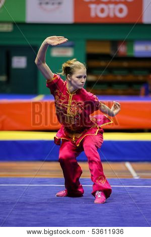 KUALA LUMPUR - NOV 03: Temna Liudmyla of Ukraine shows her fighting style in the 'changquan compulsory' event at the 12th World Wushu Championship on November 03, 2013 in Kuala Lumpur, Malaysia.