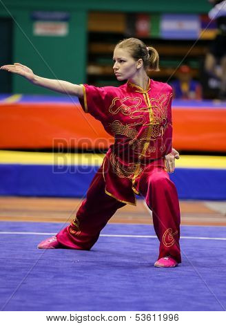 KUALA LUMPUR - NOV 03: Temna Liudmyla of Ukraine shows her fighting style in the 'changquan compulsory' event at the 12th World Wushu Championship on November 03, 2013 in Kuala Lumpur, Malaysia.