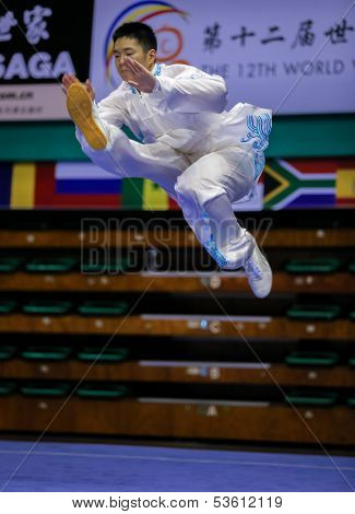 KUALA LUMPUR - NOV 03: Jonathan Leung of Canada shows his taiji quan martial arts moves in the 'taiji quan' event at the 12th World Wushu Championship on November 03, 2013 in Kuala Lumpur, Malaysia.