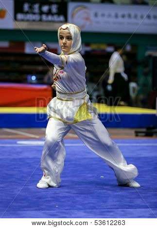 KUALA LUMPUR - NOV 03: Zeynep Akyuz of Turkey shows her fighting style in the 'changquan compulsory' event at the 12th World Wushu Championship on November 03, 2013 in Kuala Lumpur, Malaysia.